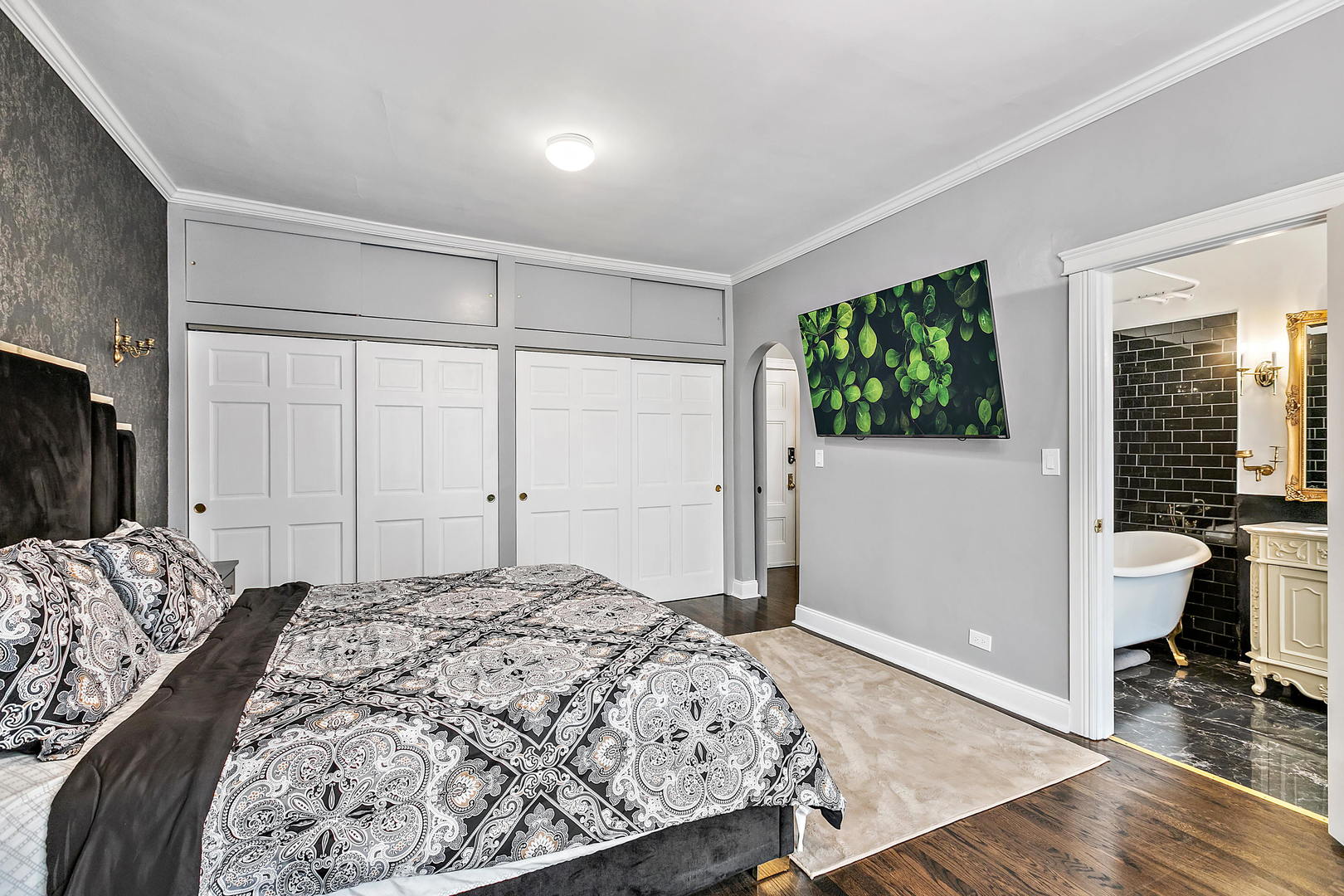 60 East Scott Street, Unit 703 Chicago, IL 60610 - Photo 17 of 27 a bedroom with a bed and a window