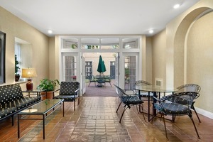 60 East Scott Street, Unit 703 Chicago, IL 60610 - Photo 25 of 27 a living room with furniture and large windows