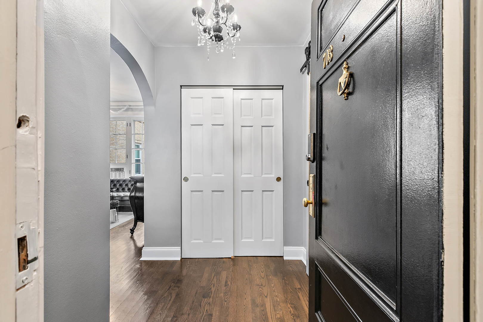 60 East Scott Street, Unit 703 Chicago, IL 60610 - Photo 3 of 27 a view of a hallway with wooden floor and staircase