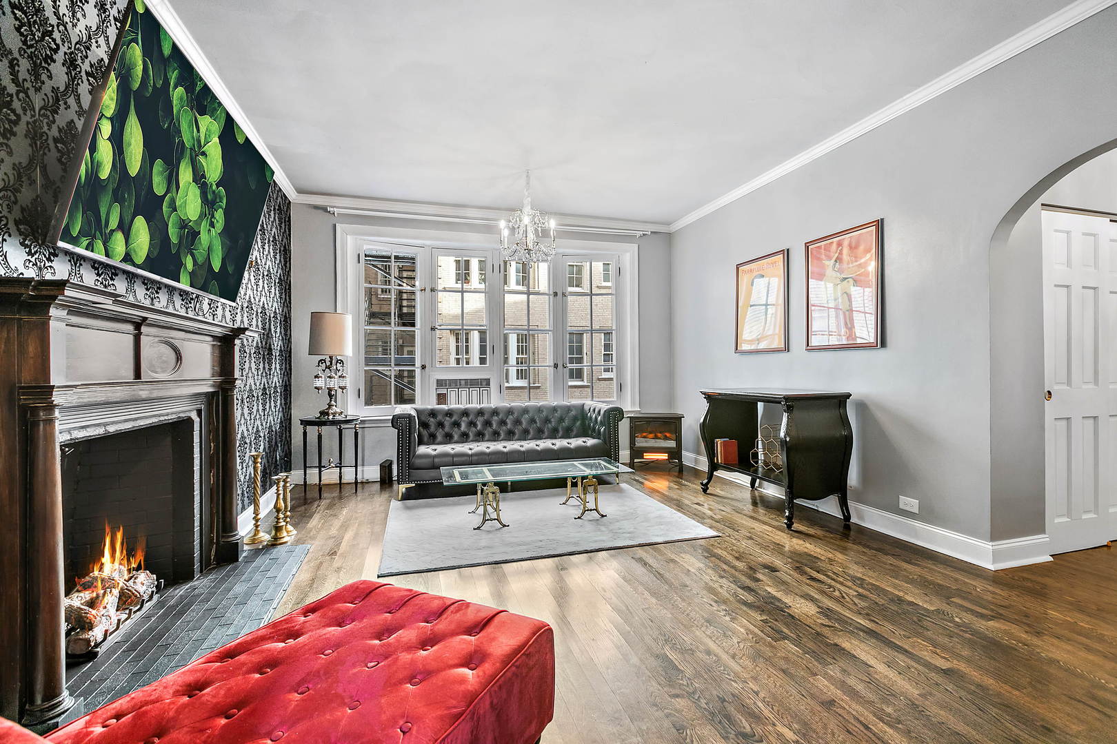 60 East Scott Street, Unit 703 Chicago, IL 60610 - Photo 5 of 27 a living room with furniture a window and a fireplace