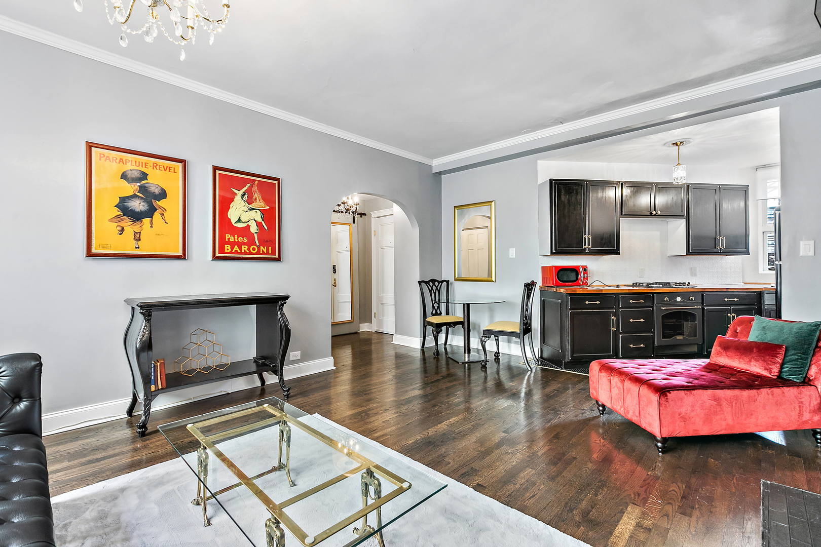 60 East Scott Street, Unit 703 Chicago, IL 60610 - Photo 6 of 27 a living room with furniture and a wooden floor