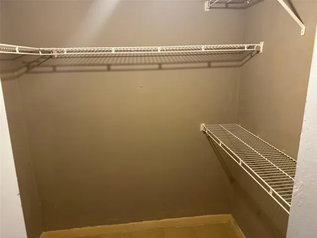 a view of a room with racks on the wall