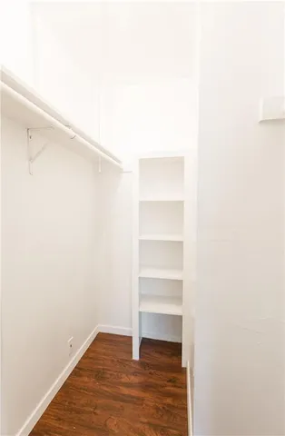 a view of an empty walk in closet