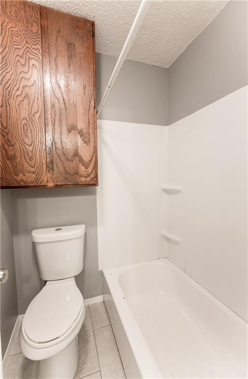 2008 West Loop, Unit D Austin, TX 78758 - Photo 15 of 15 a bathroom with a toilet and a bathtub