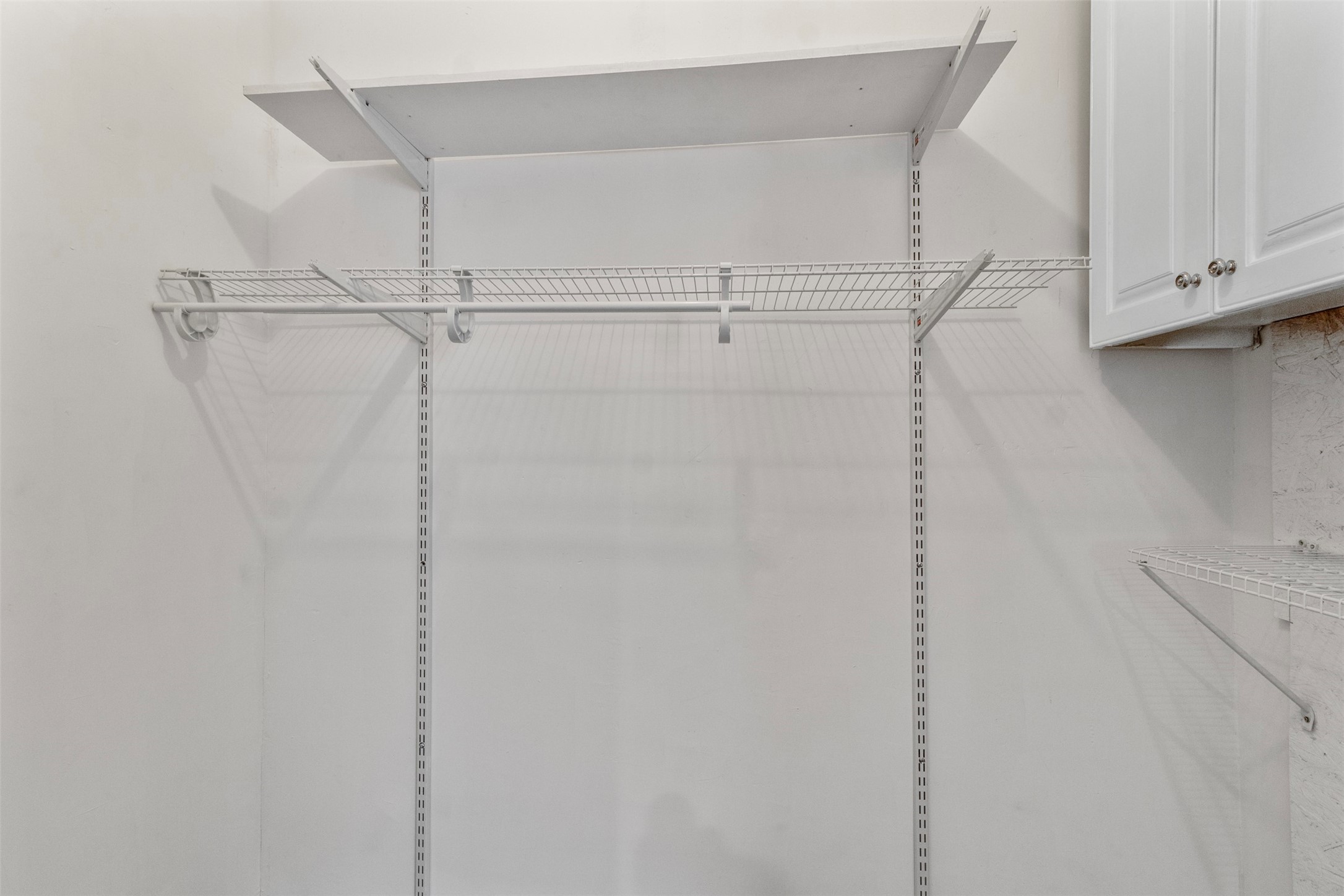 405 Medina Street, Unit B Houston, TX 77012 - Photo 13 of 16 a view of walk in closet with empty racks