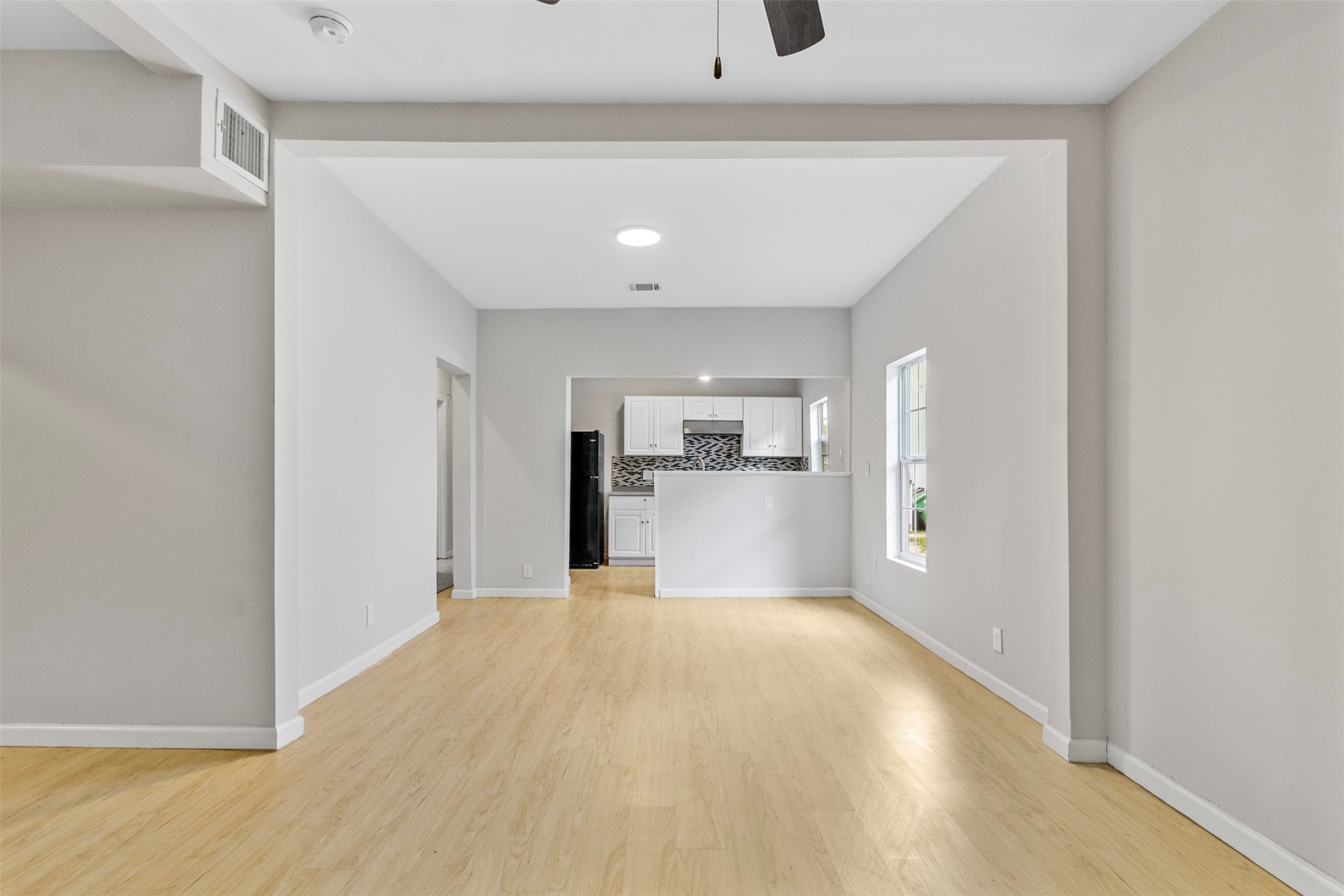 405 Medina Street, Unit B Houston, TX 77012 - Photo 4 of 16 a view of a kitchen with a sink and a refrigerator