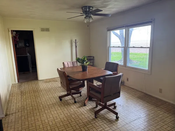 a close up of a utility room with water heater and racks