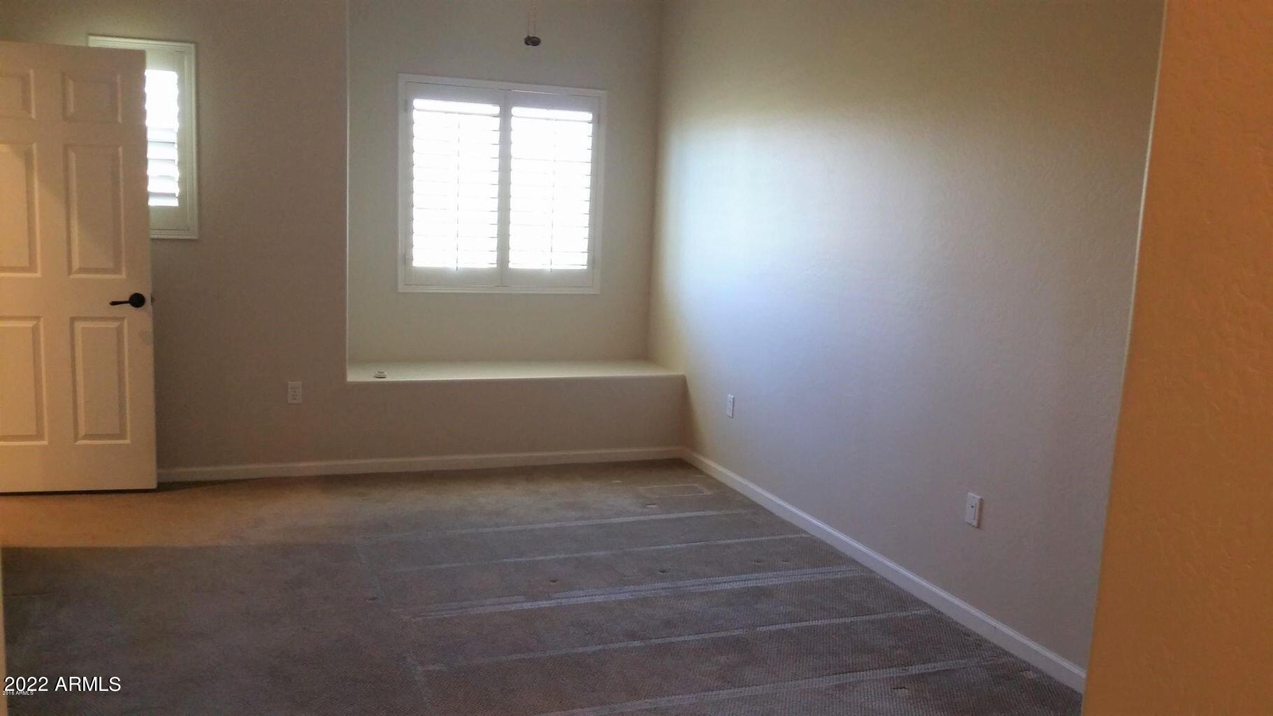 3935 East Rough Rider Road, Unit 1074 Phoenix, AZ 85050 - Photo 13 of 22 Primary bedroom 1