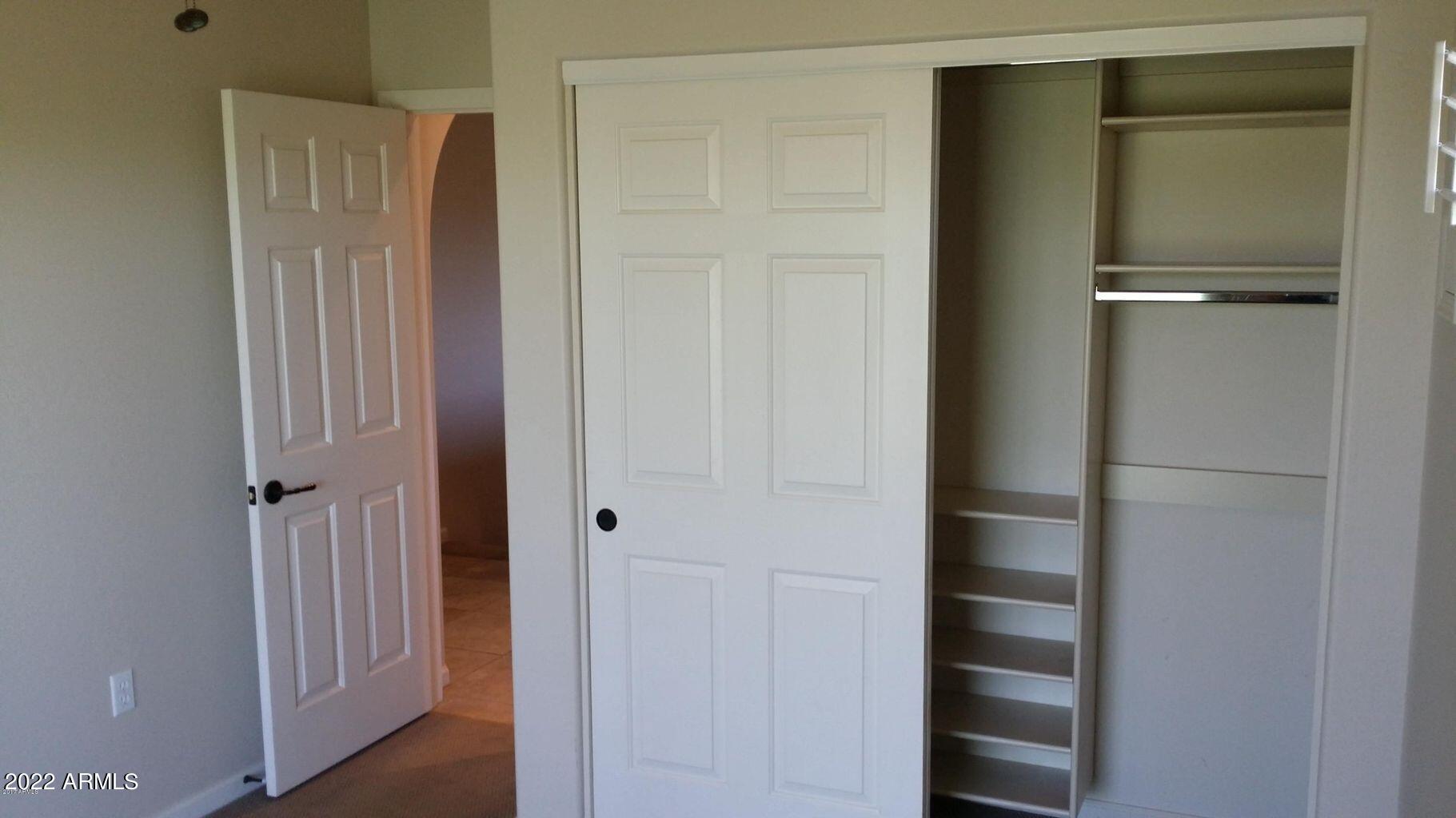 3935 East Rough Rider Road, Unit 1074 Phoenix, AZ 85050 - Photo 17 of 22 2nd bedroom closet