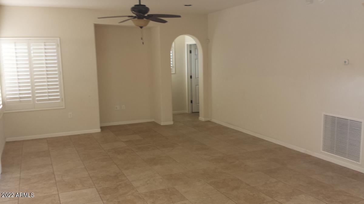 3935 East Rough Rider Road, Unit 1074 Phoenix, AZ 85050 - Photo 9 of 22 Living area 2