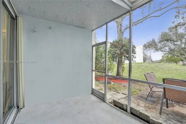 a view of an empty room with a window