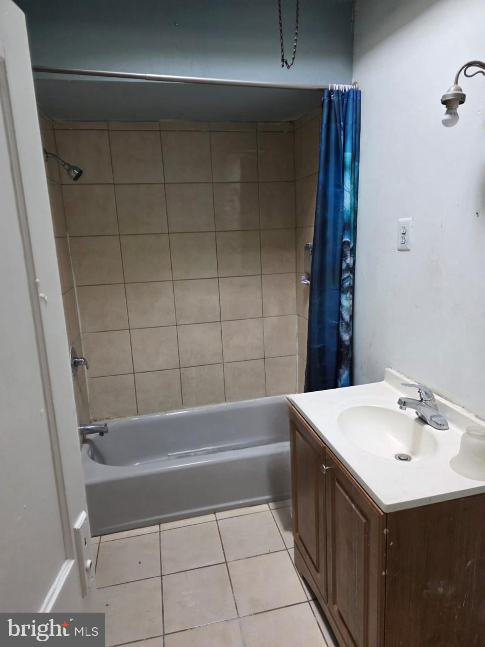 5805 North 15th Street Philadelphia, PA 19141 - Photo 6 of 12 a bathroom with a sink a toilet and shower