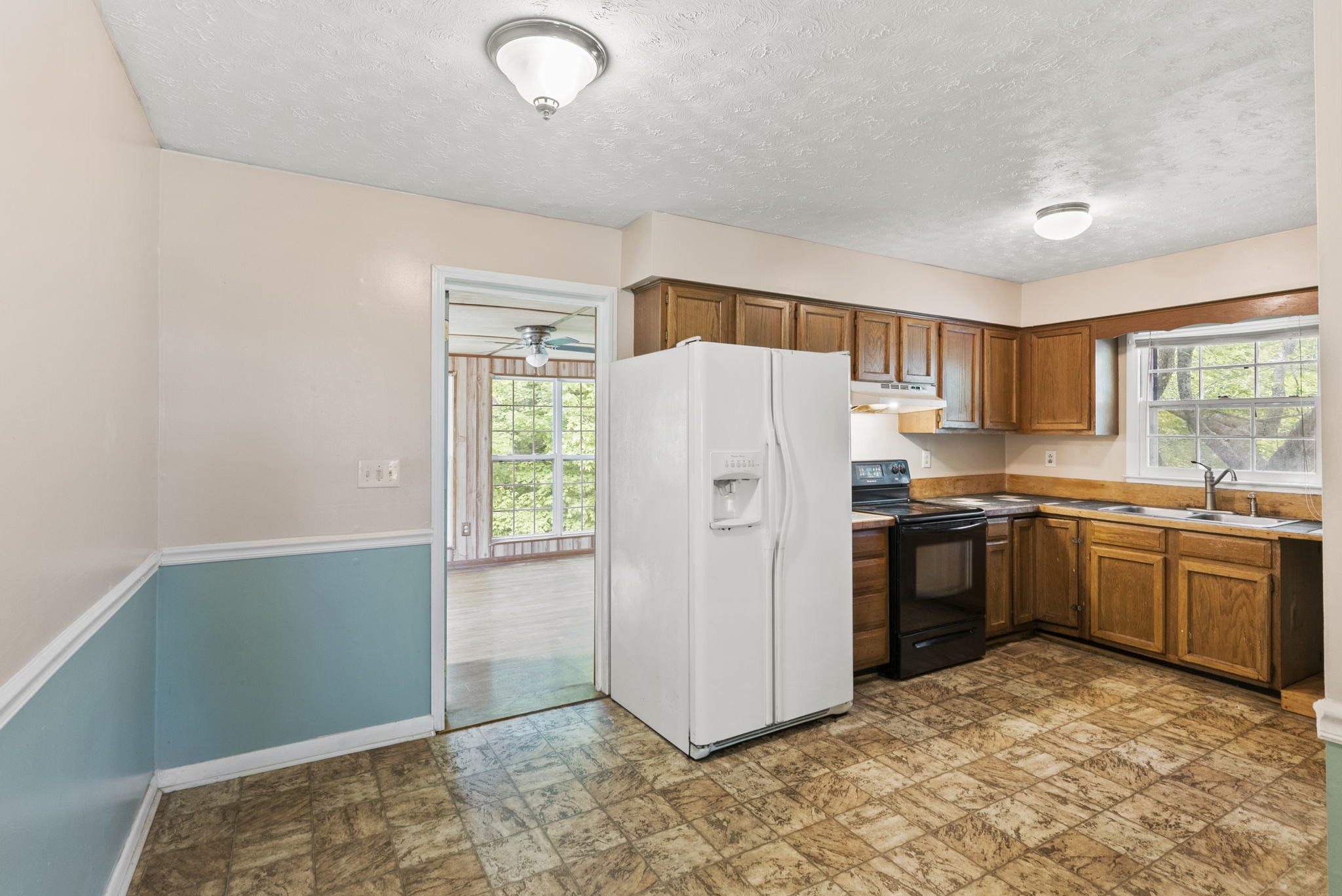 4431 Airport Road Springfield, TN 37172 - Photo 7 of 20 a kitchen with a refrigerator and a sink