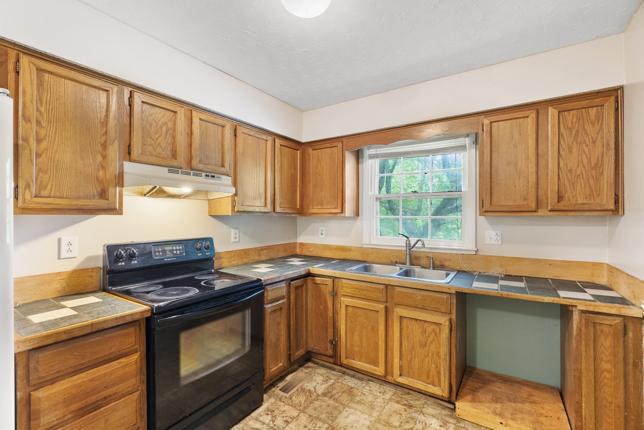 4431 Airport Road Springfield, TN 37172 - Photo 9 of 20 a kitchen with a sink stove top oven and cabinets
