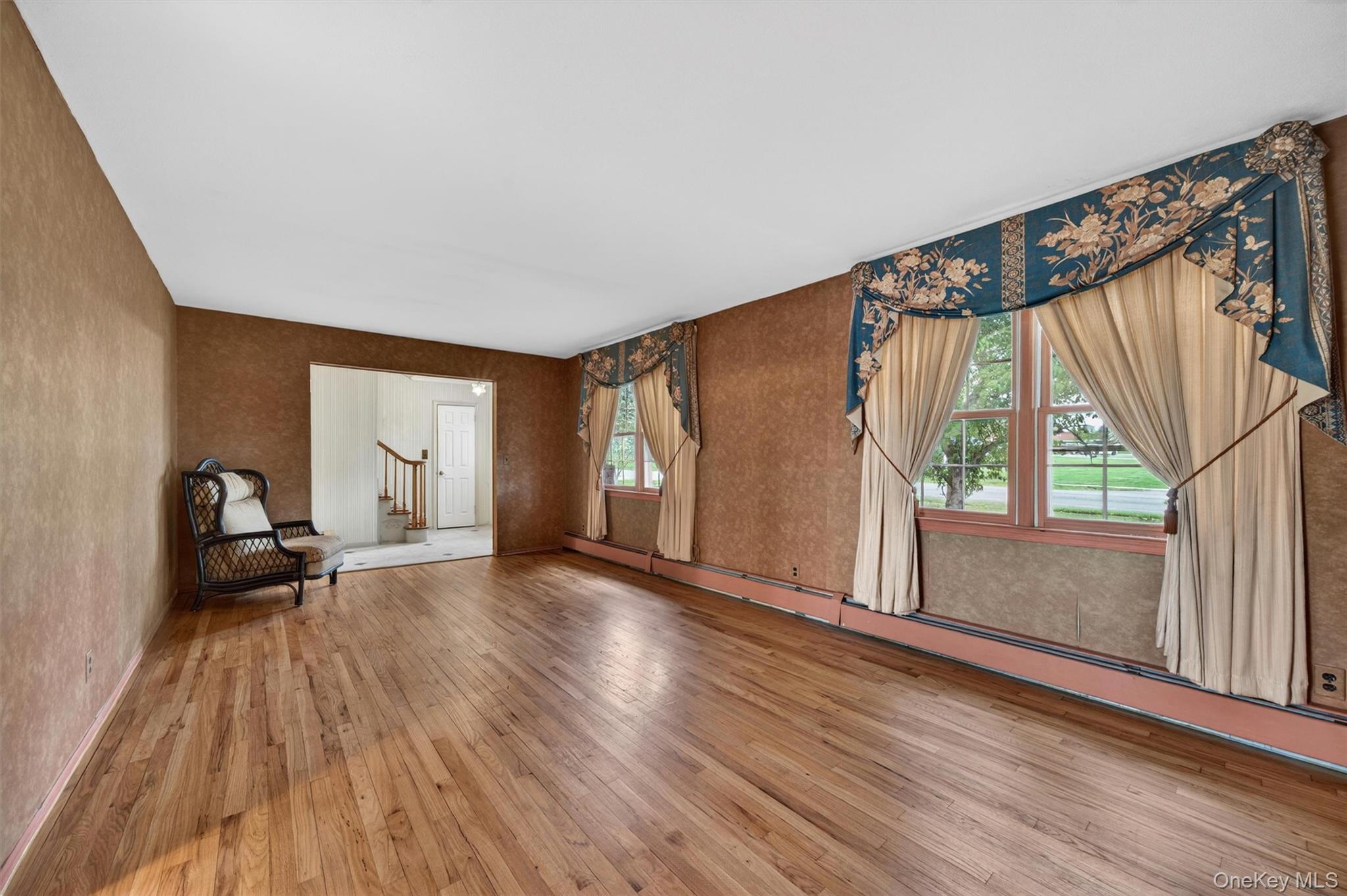 155 Pine Tree Road Monroe, NY 10950 - Photo 8 of 49 a view of an empty room with wooden floor and a window