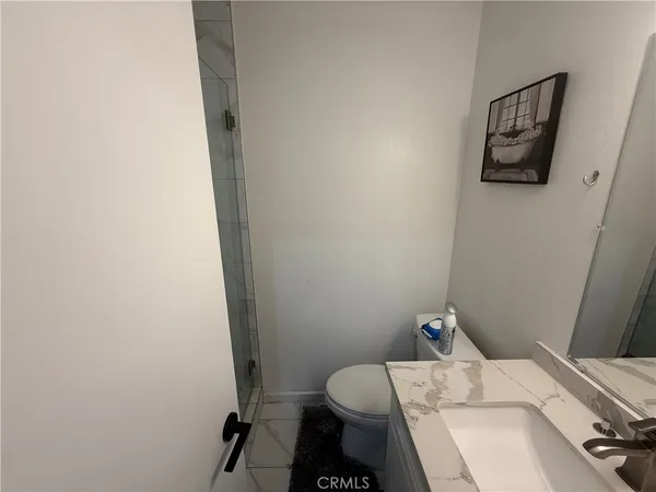 a bathroom with a sink and toilet