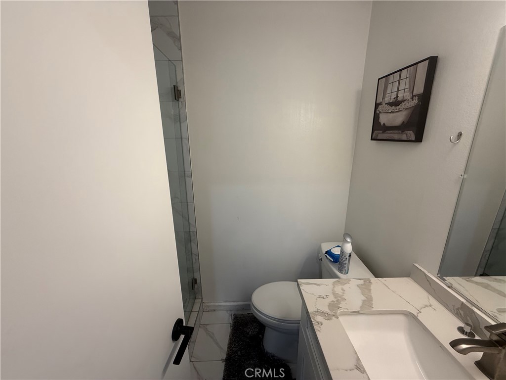 9702 Vía Roma Burbank, CA 91504 - Photo 11 of 19 a bathroom with a sink and toilet