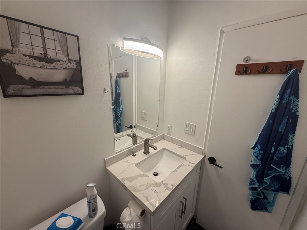 9702 Vía Roma Burbank, CA 91504 - Photo 12 of 19 a bathroom with a sink vanity and a mirror