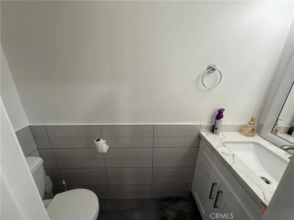 a bathroom with a sink toilet and vanity