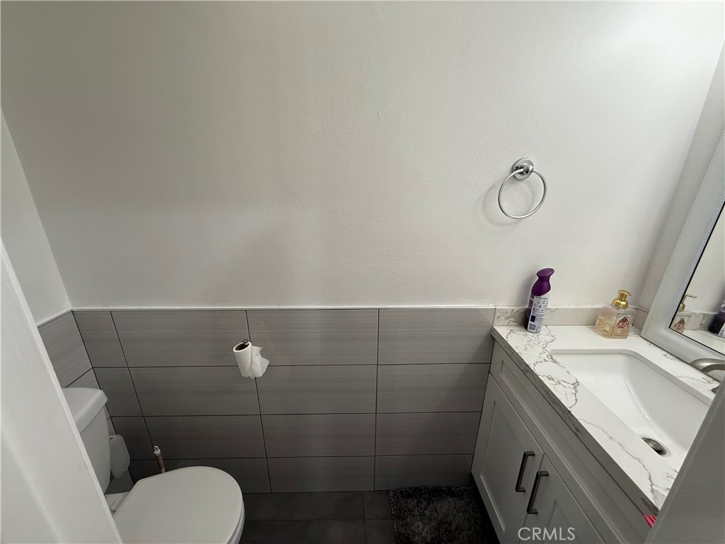 9702 Vía Roma Burbank, CA 91504 - Photo 16 of 19 a bathroom with a sink toilet and vanity