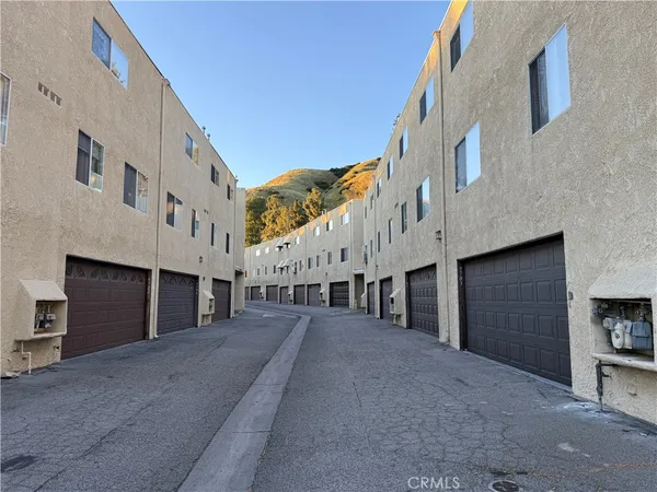 a view of a building with a street