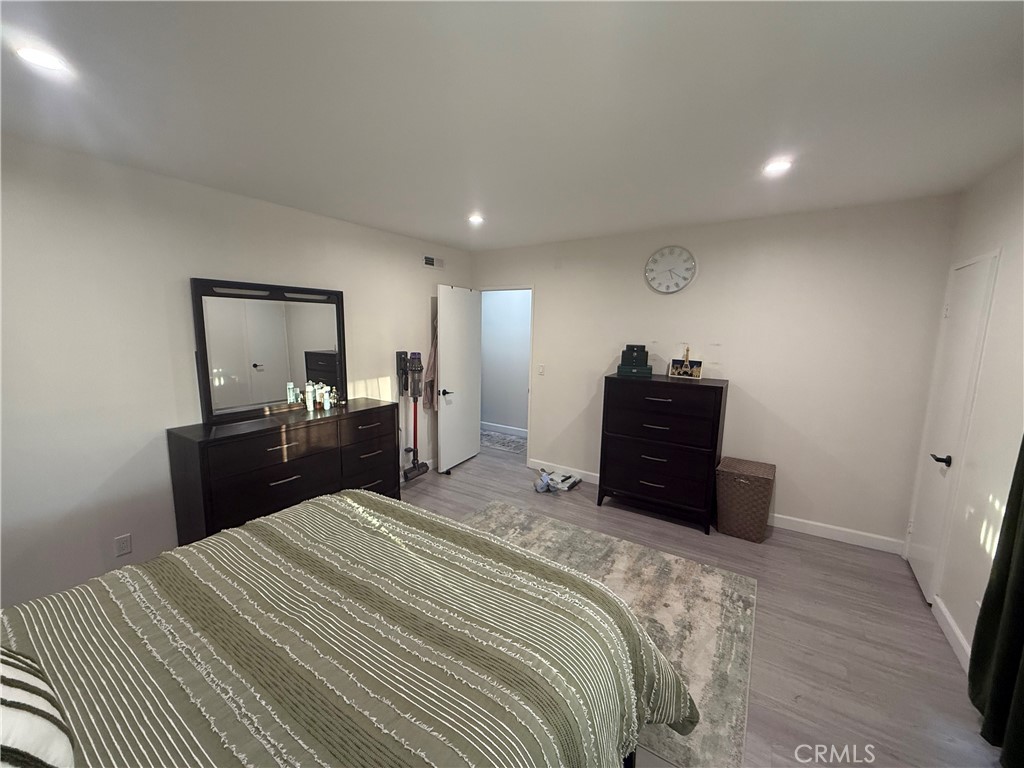 9702 Vía Roma Burbank, CA 91504 - Photo 7 of 19 a bedroom with a bed and a dresser