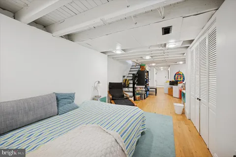 a bedroom with furniture and a chandelier
