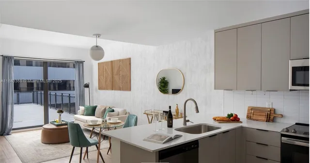 a kitchen with a sink cabinets and appliances
