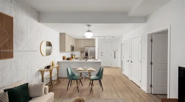 a dining room with table and chairs