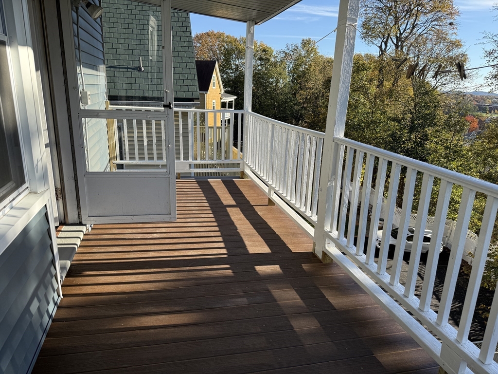 17 Wales Street, Unit 3 Boston, MA 02124 - Photo 13 of 17 a view of a balcony with wooden floor