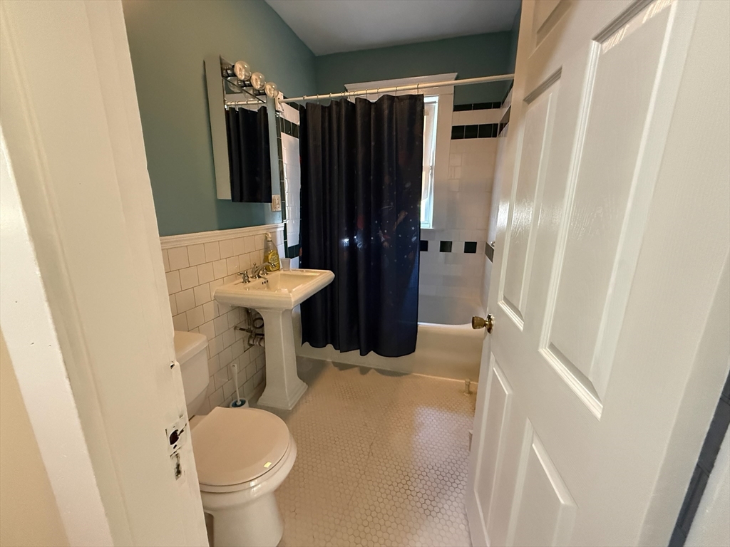 17 Wales Street, Unit 3 Boston, MA 02124 - Photo 7 of 17 a bathroom with a sink toilet and shower