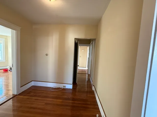 a view of a balcony with wooden floor
