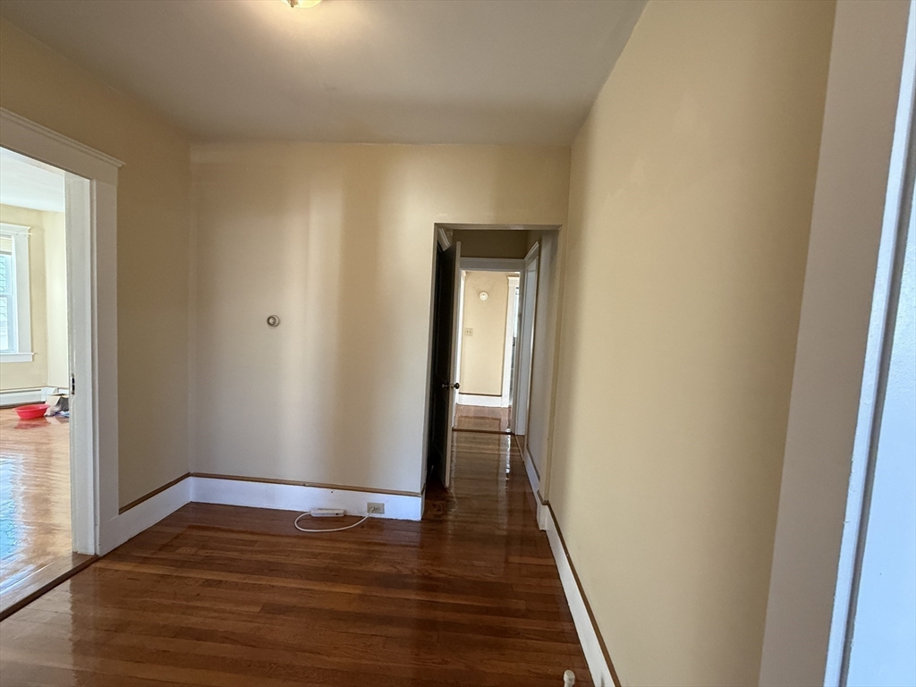 17 Wales Street, Unit 3 Boston, MA 02124 - Photo 10 of 17 a view of a hallway with wooden floor