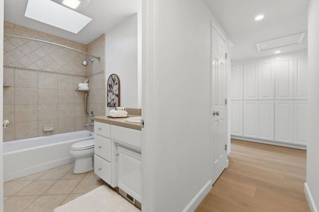 a bed room with a bed and a window