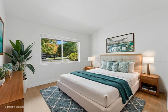 a spacious bathroom with a tub and a shower