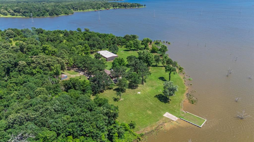 476 Private Road 7326 Emory, TX 75440 - Photo 9 of 33 an aerial view of a house with a yard