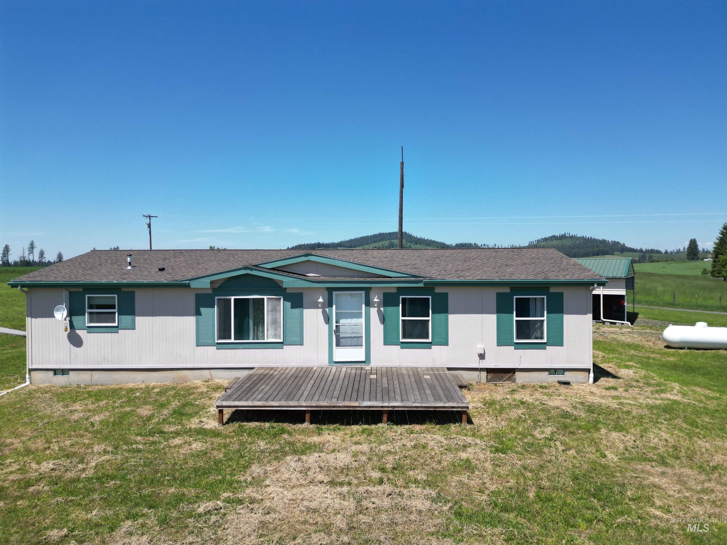 135 Harrisburg Road Kamiah, ID 83536 - Photo 25 of 41 Single-story residence featuring a gray exterior siding and green trim accents