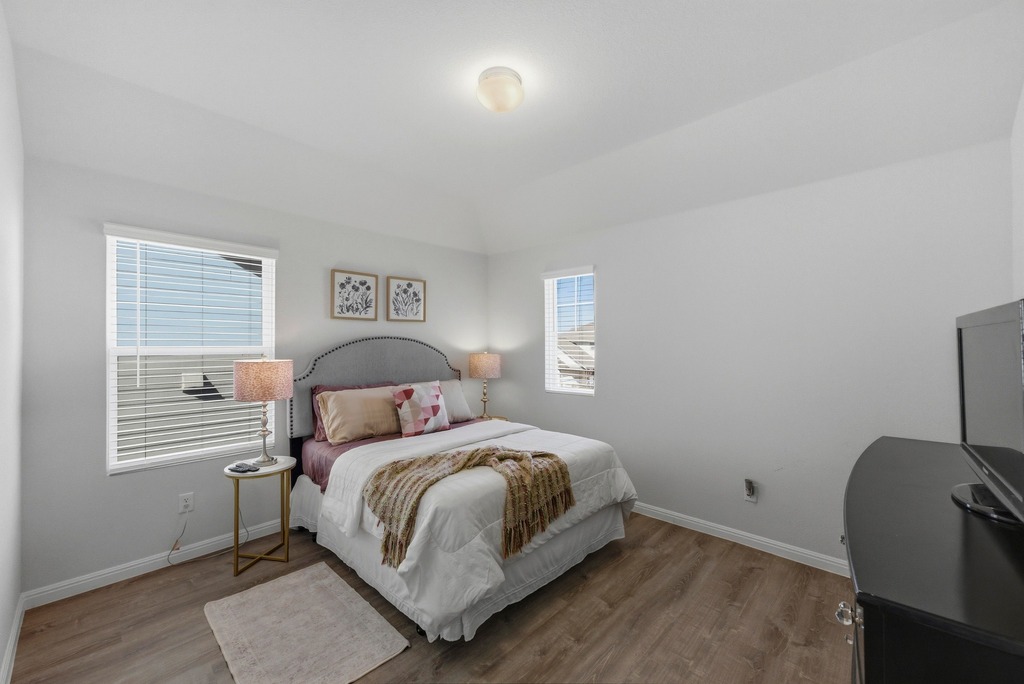 264 Denali Way Dripping Springs, TX 78620 - Photo 18 of 28 Bedroom featuring baseboards and wood finished floors