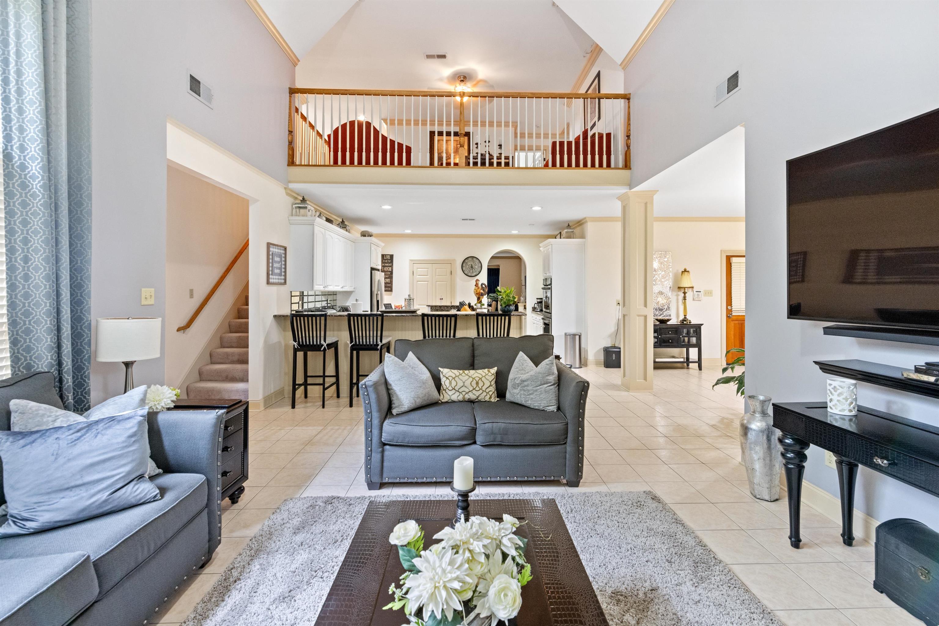11241 Latting Road Eads, TN 38028 - Photo 16 of 31 Tiled living room featuring ornamental molding and high vaulted ceiling