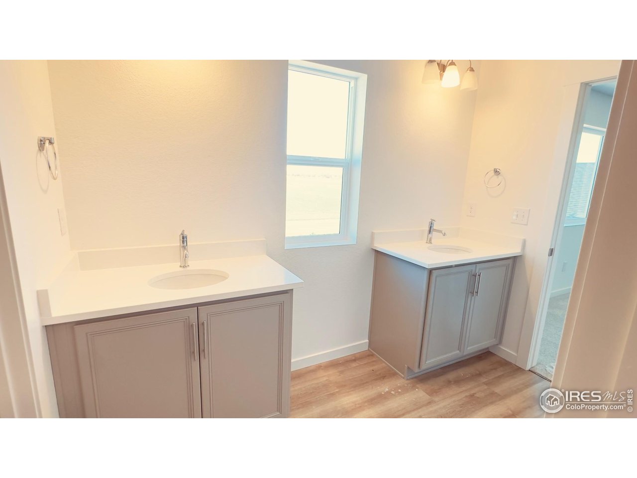 677 Muturu Road Johnstown, CO 80534 - Photo 5 of 11 a bathroom with a sink and a mirror