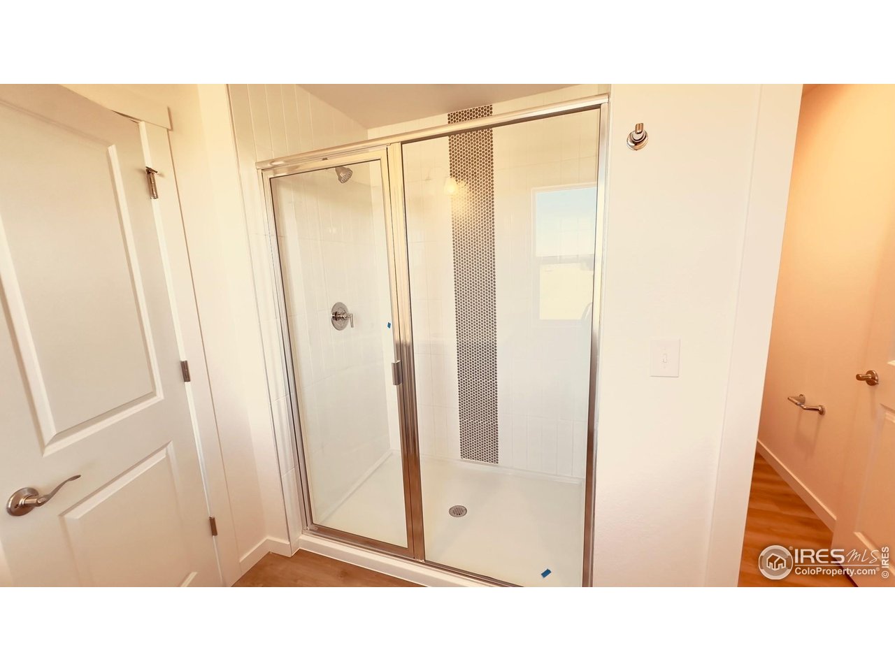 677 Muturu Road Johnstown, CO 80534 - Photo 6 of 11 a bathroom with a shower and a sink