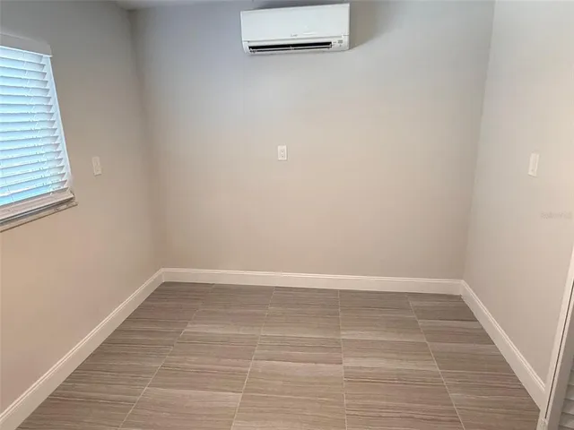a bathroom with a sink vanity and a toilet
