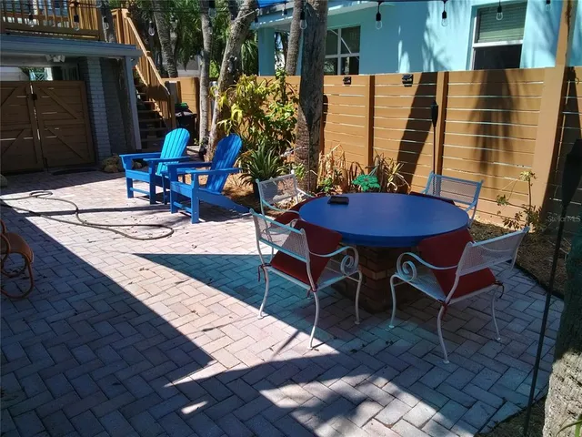 a view of a tables and chairs in patio