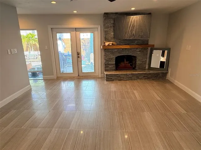 a view of a kitchen with an empty space and a window