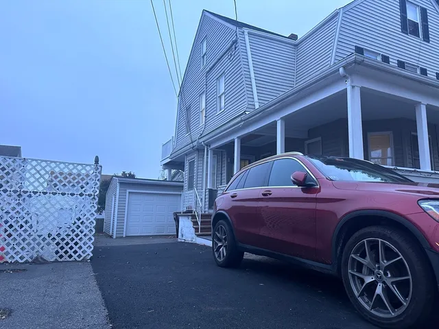 a front view of a house with parking space