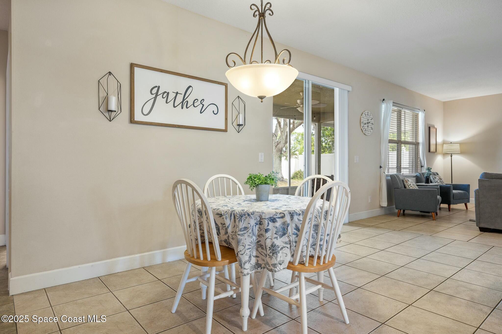 320 Pebble Hill Way Rockledge, FL 32955 - Photo 16 of 34 a view of a dining room with furniture window and outside view