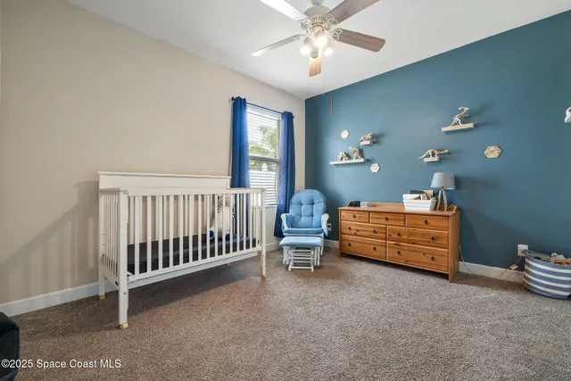 a bed room with furniture and a window