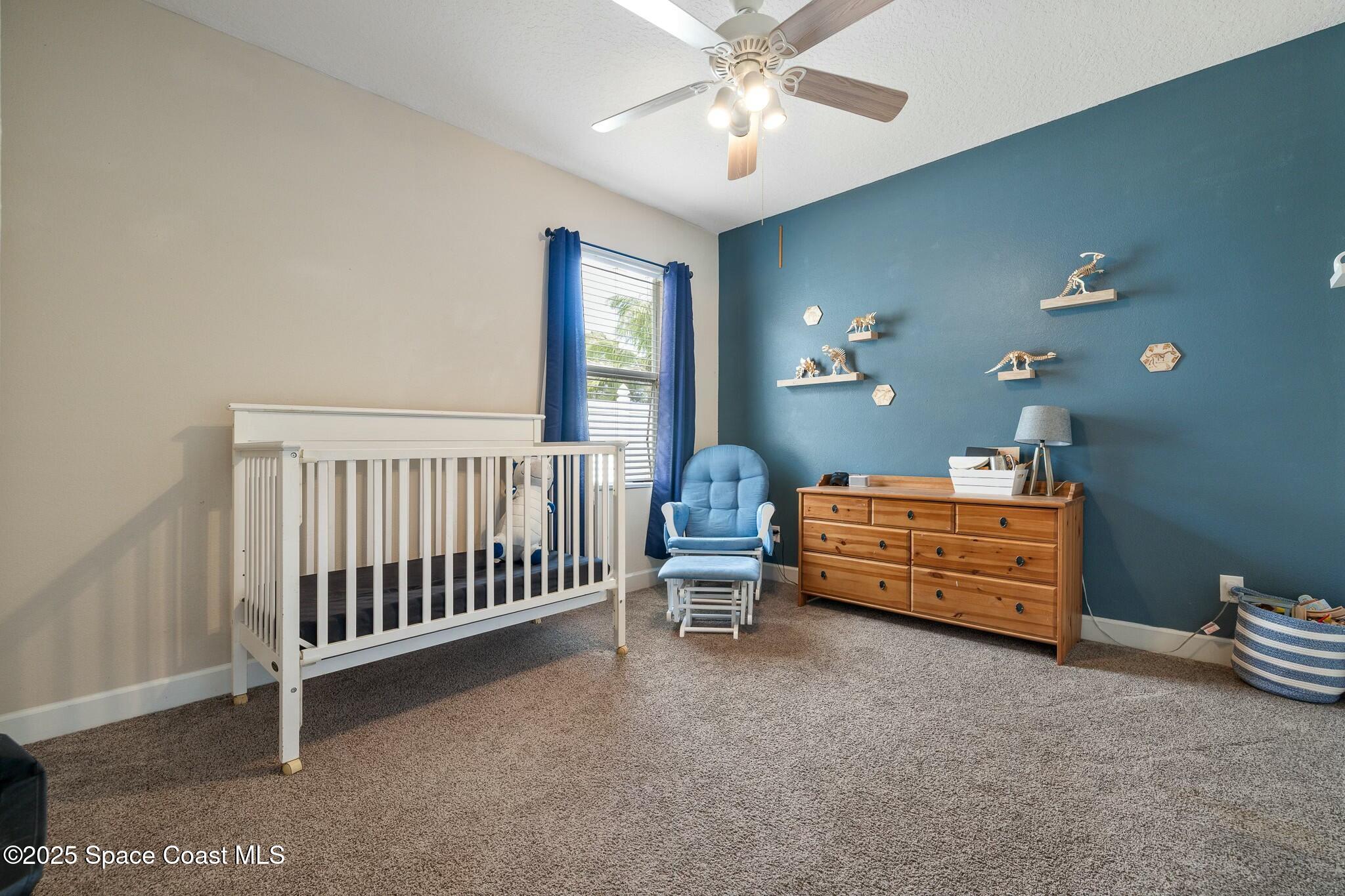 320 Pebble Hill Way Rockledge, FL 32955 - Photo 21 of 34 a bed room with furniture and a window