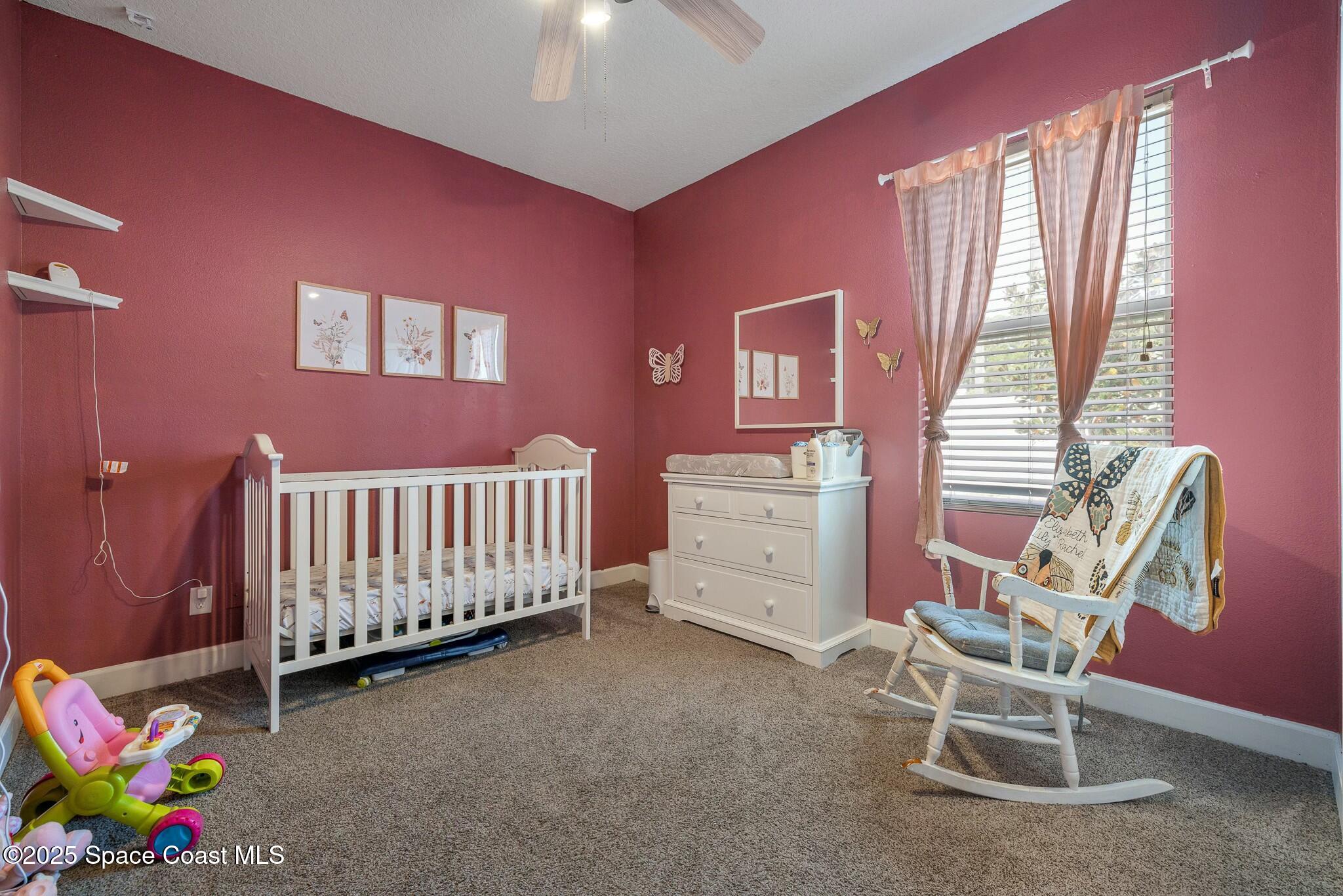 320 Pebble Hill Way Rockledge, FL 32955 - Photo 22 of 34 a bedroom with furniture and a window