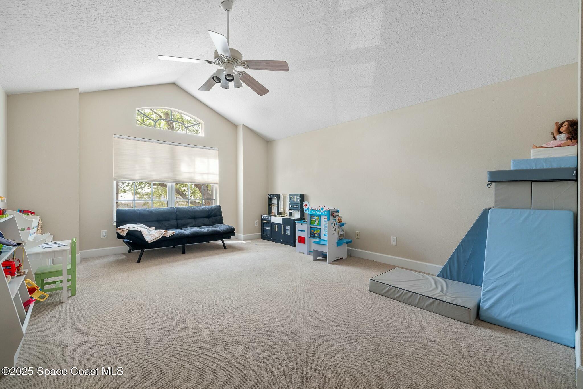 320 Pebble Hill Way Rockledge, FL 32955 - Photo 25 of 34 a view of a room with furniture and a chandelier